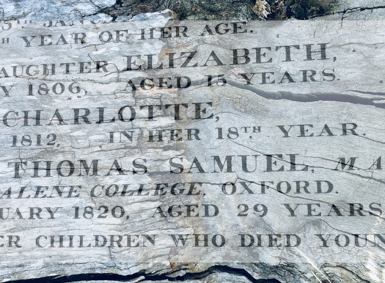 A partial shot of a tombstone